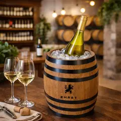 Custom engraved wooden barrel wine ice bucket with white wine and glasses on winery bar for branded promotional use