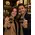 Smiling customers holding custom branded 1 oz keychain flasks inside a whiskey distillery gift shop, showcasing promotional merchandise and souvenir products.
