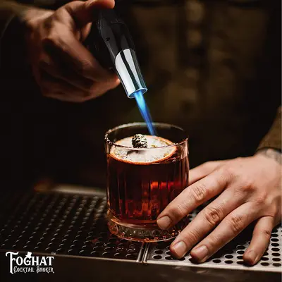 Foghat Culinary Torch flaming craft cocktail with blue jet flame for professional bar presentation