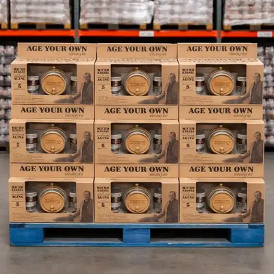 Age Your Own whiskey kits stacked on pallet for bulk retail display in warehouse store