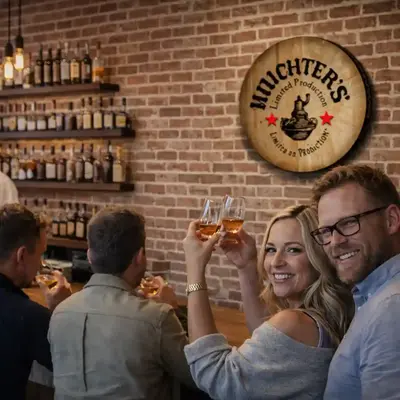 Custom engraved barrel head sign displayed in a distillery tasting room with guests toasting whiskey at the bar