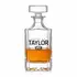 Elegant crystal whiskey decanter filled with bourbon on a clean white background